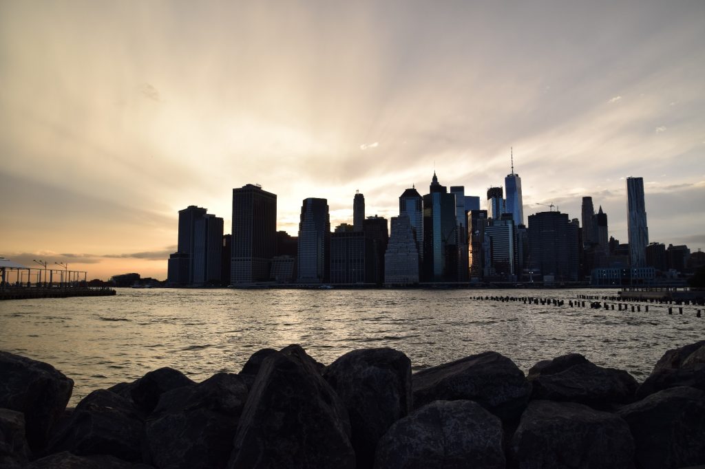 sunrise behind cityscape