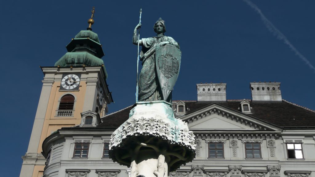 female statue with crown on fountain as Austria allegory