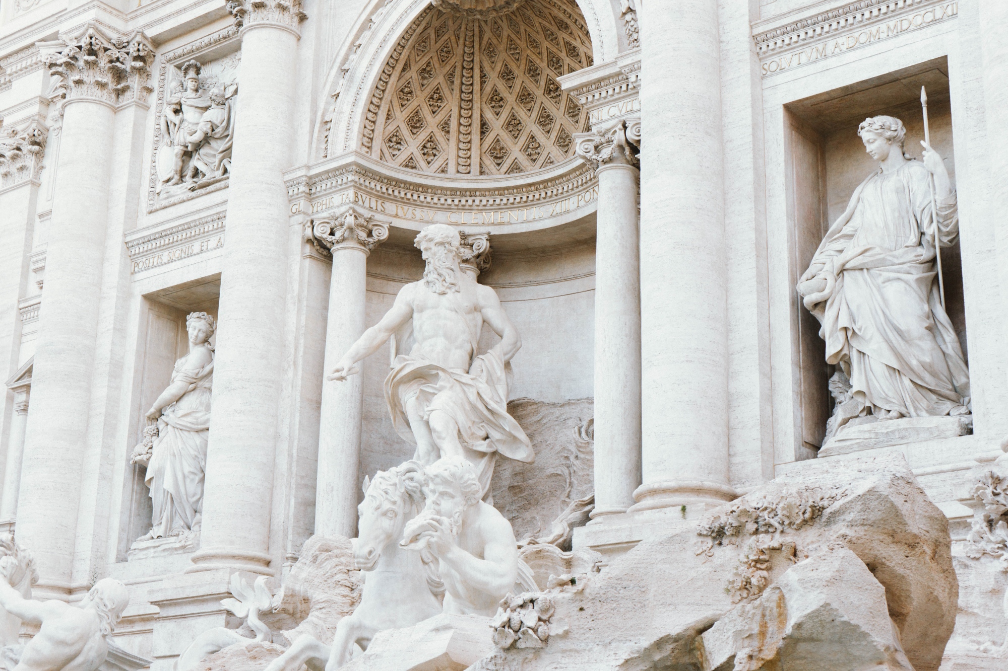 Greek god statues inside temple arcade