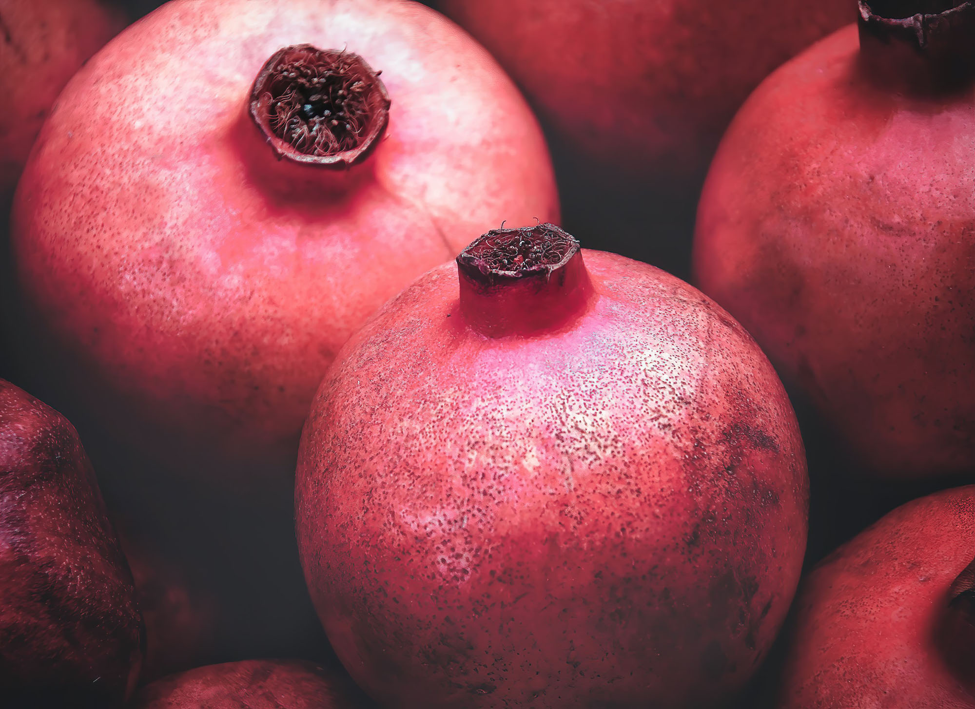 photo of unpeeled pomegrantes