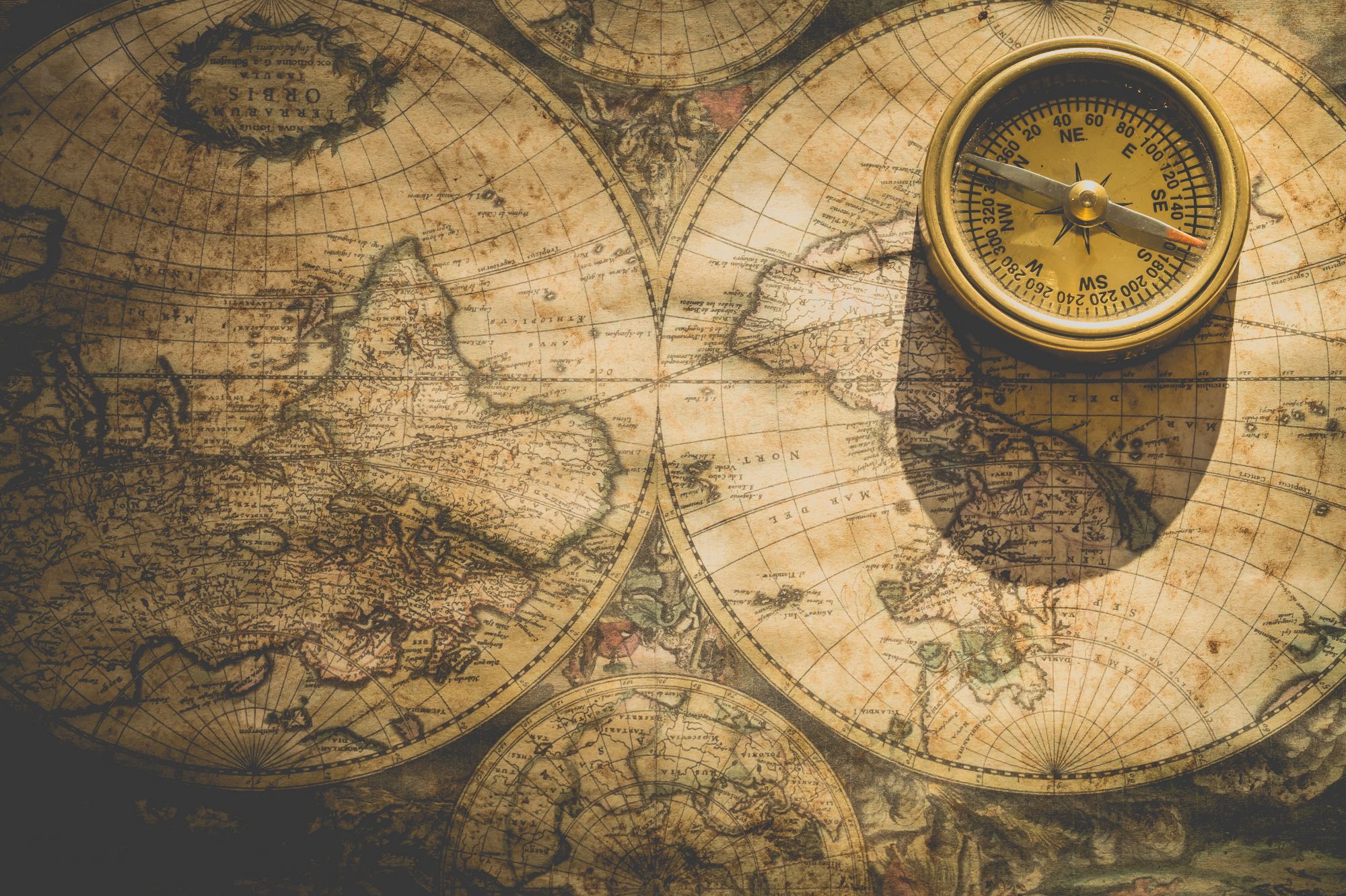 image of a world map and a compass