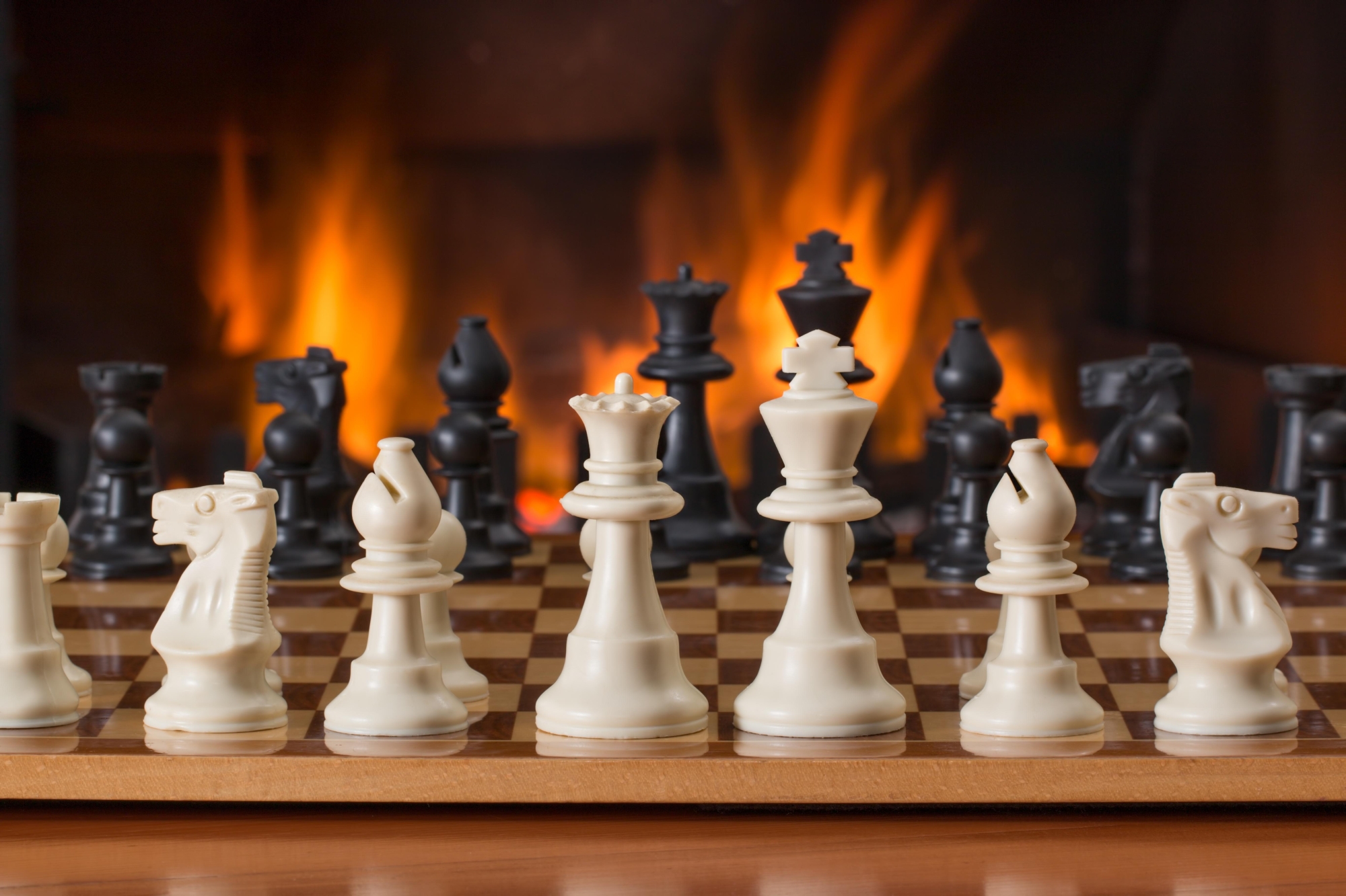 game of chess with fire in background