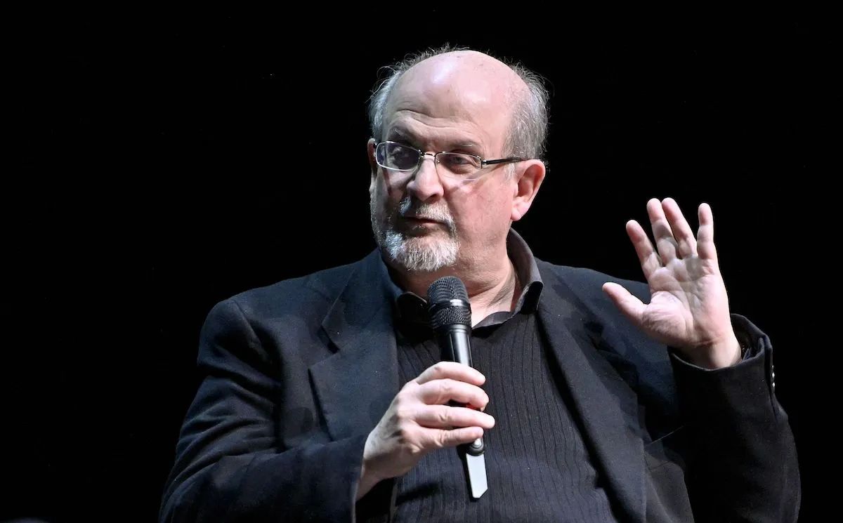 Image showing Salman Rushdie discussing with mic in hand