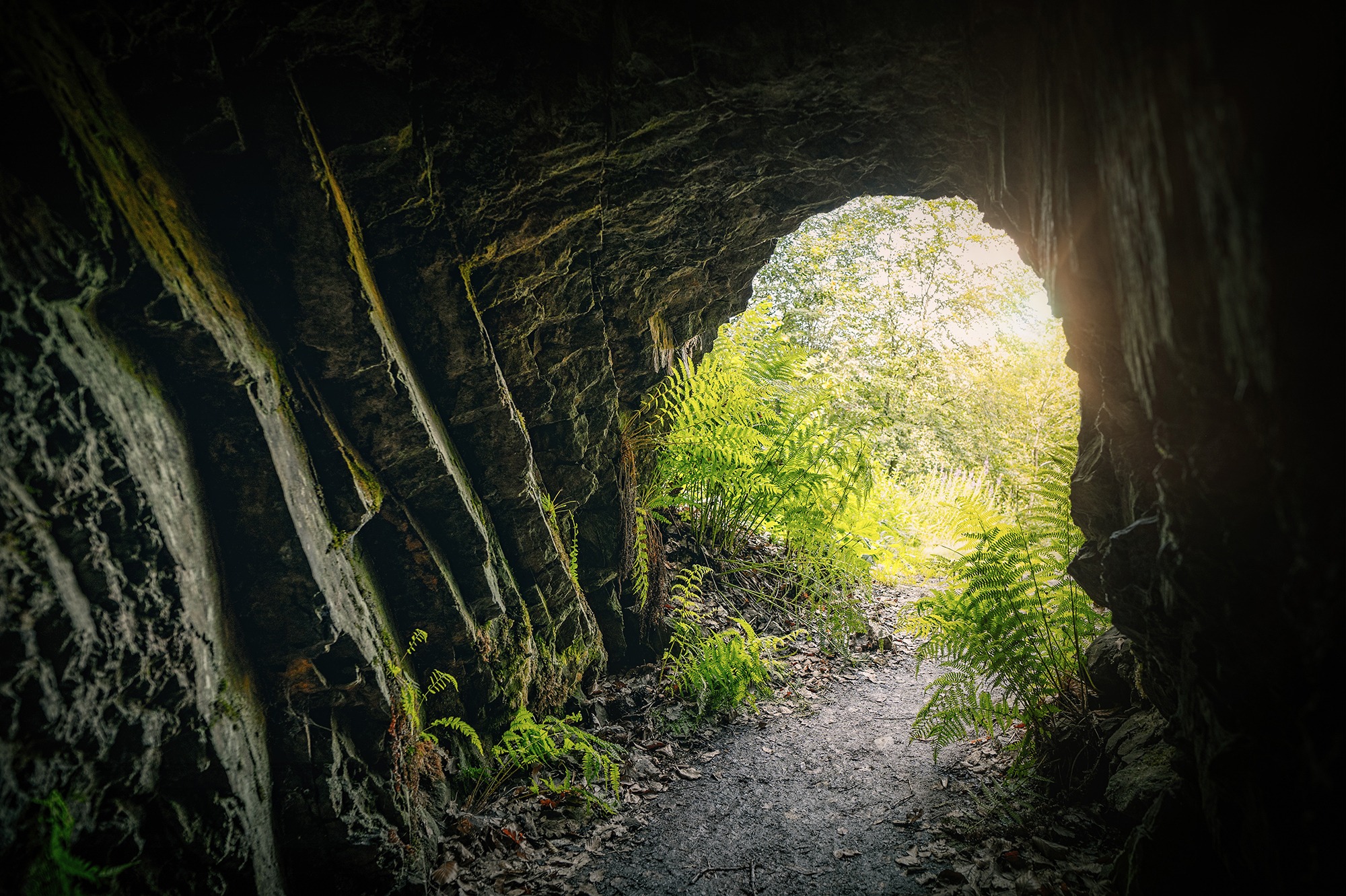 Image of a cave with light at the exit