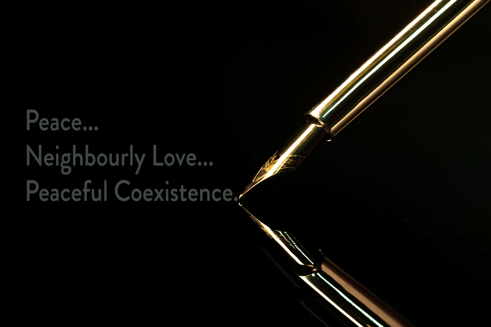Image of a gold pen writing the words Peace, Neighbourly Love, Peaceful Coexistence on a dark background