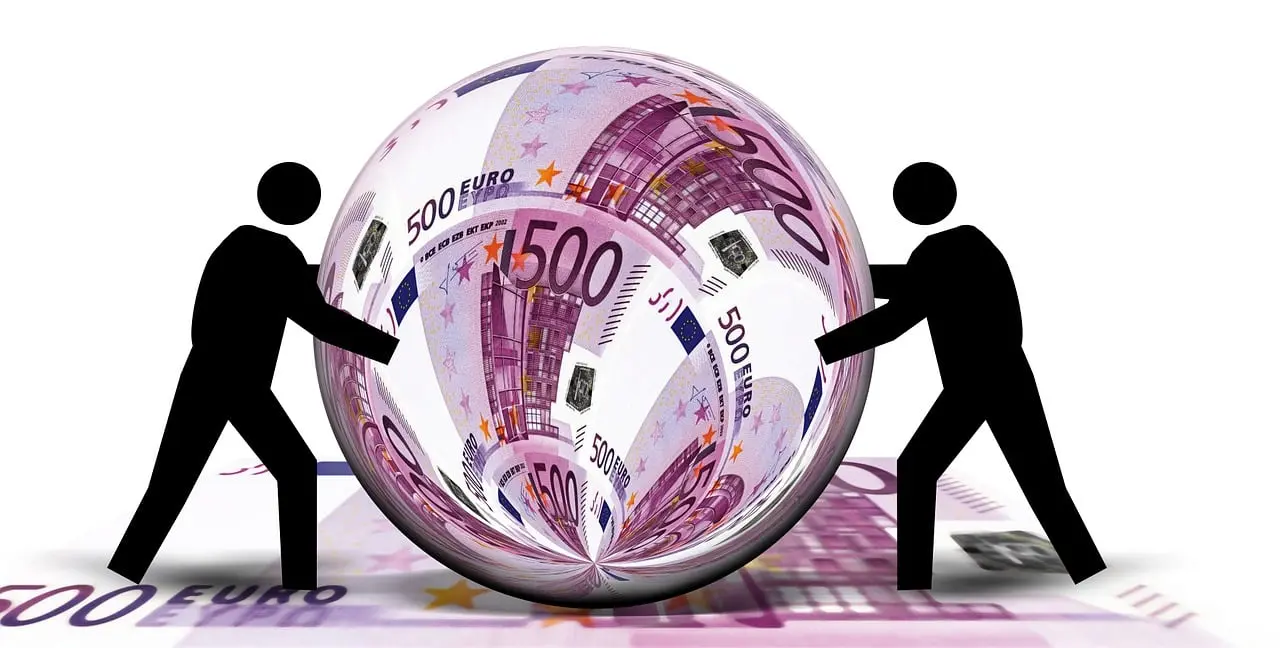 A glass ball reflecting a hundred euro bill and two black silhouettes of figures pushing it, standing on more euro bills at their feet.