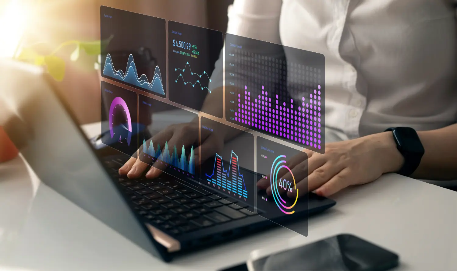 Female sitting in front of laptop that shows air-borne, transparent analytics and graphs.