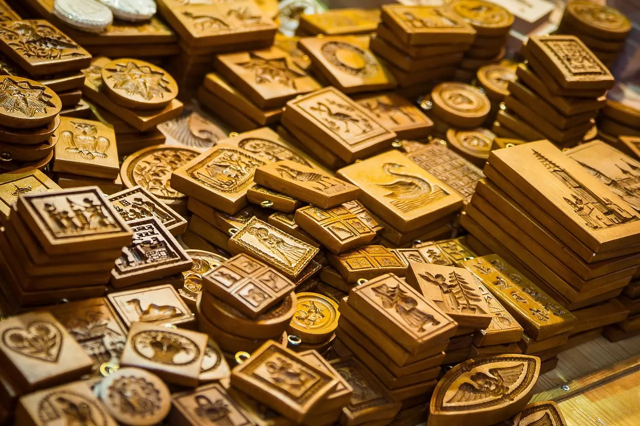 photo of a heap of slightly disorderly cookie moulds in several shapes, in a nice lighting.